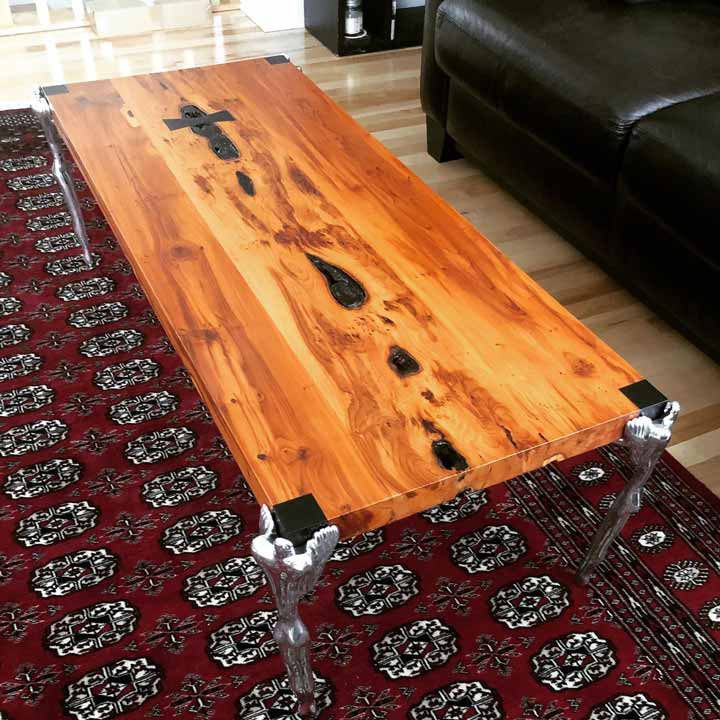 English yew coffee table with aluminum legs.